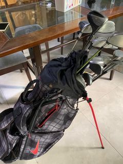 Assorted Golf Clubs and Nike Golf Bag