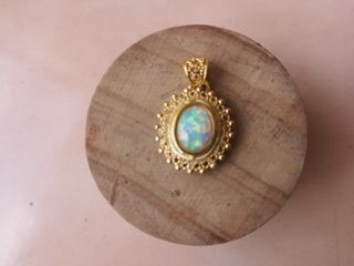 Handcrafted filigree pendant in 925 silver with 7x9mm  white Opal