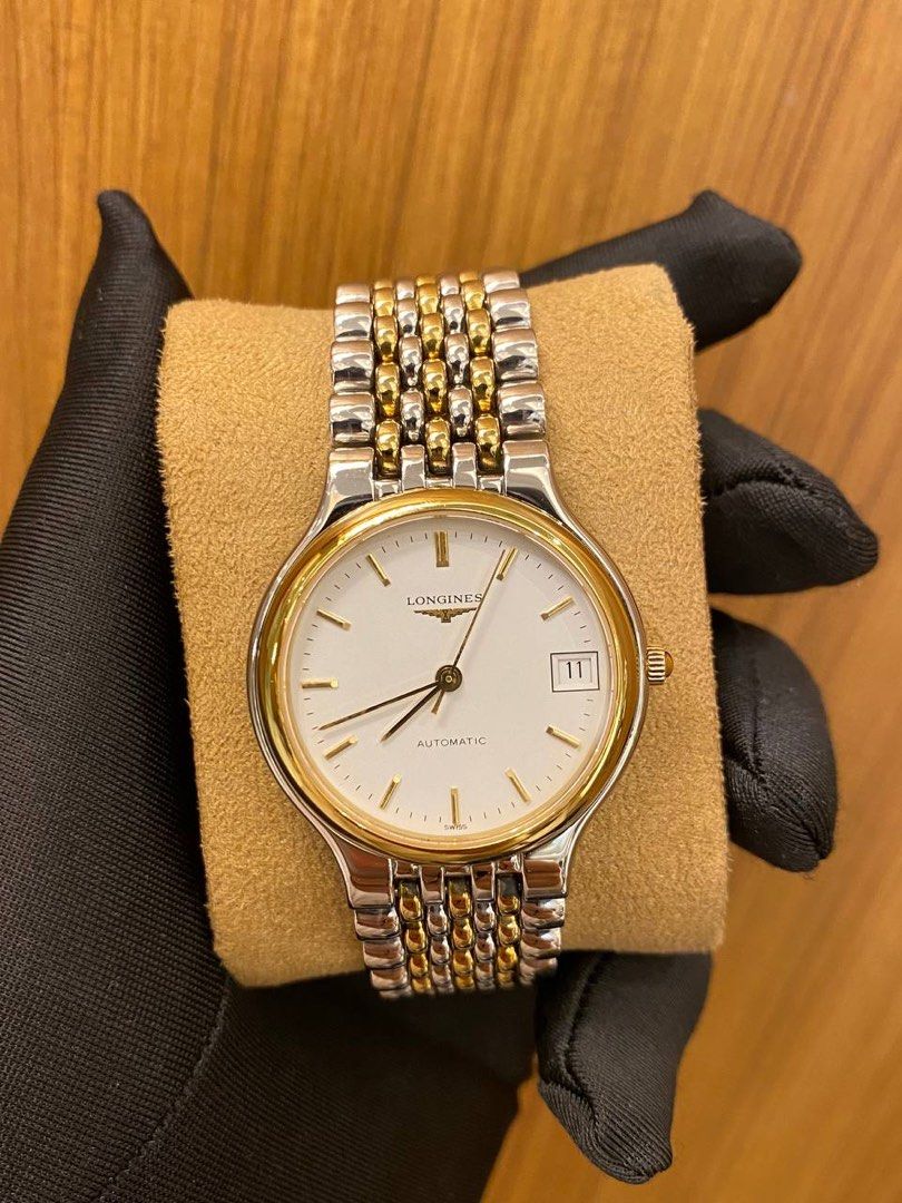 Men's watch gold plated and steel brand Longines, model …