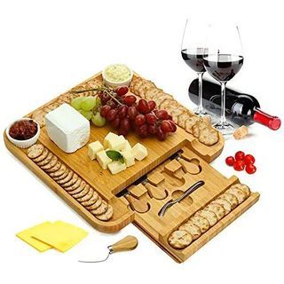 Single drawer charcuterie cheese board with ceramic bowls and tools
