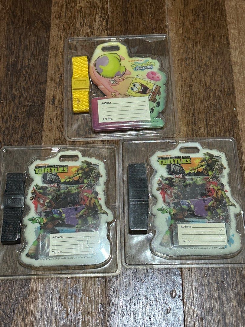 Bag Tags (TMNT / Spongebob & Patrick) sold per pice (Category: Character Goods) located in Quezon City. Submitted by mikkos_closet (Listing ID 1267703217, Image 2). Description: Sold per piece Sealed / Brand New Packaging looking Yellowish due to prolong storage Size approximately L- 5 x W-3.5 inches: .