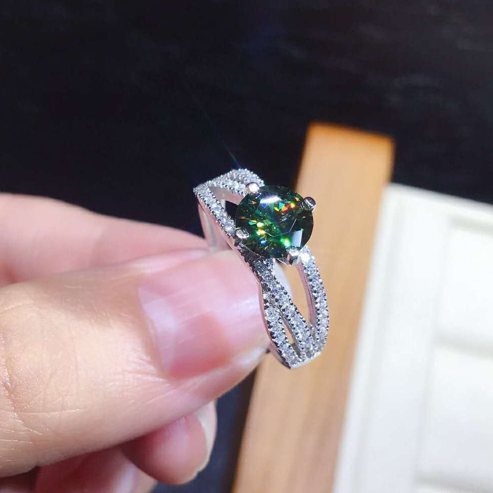 Gold ring with green diamond store