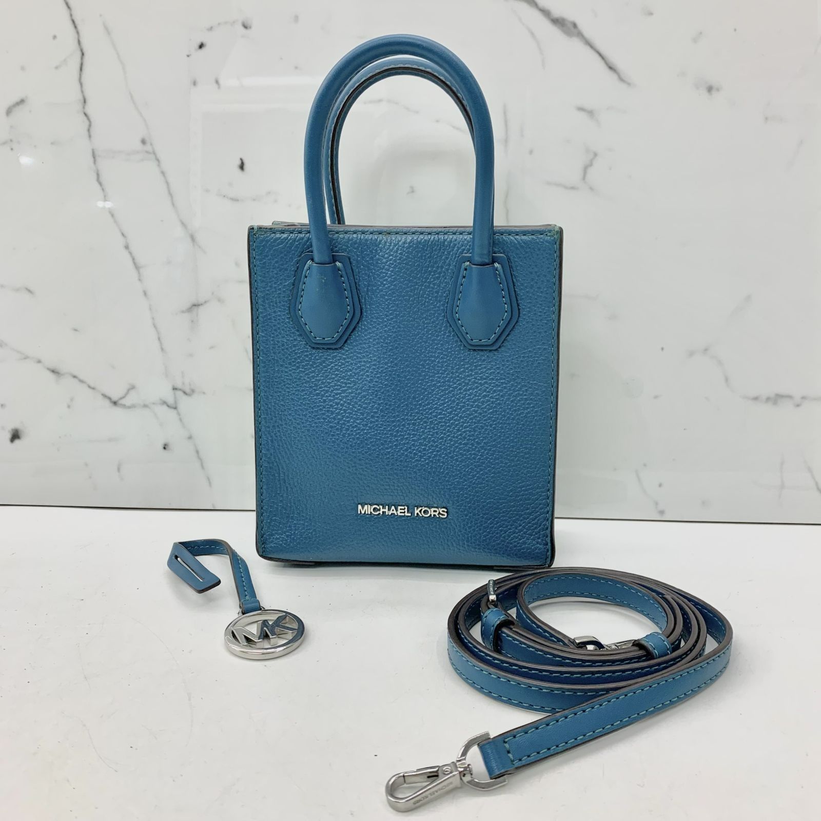 MK online turquoise bag