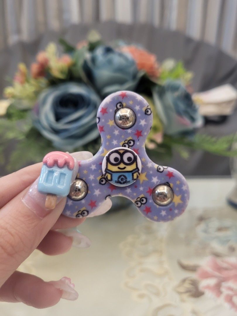 Minion Mini Fidget Spinner (Category: Character Goods) located in San Fernando. Submitted by jpmarketplace2023 (Listing ID 1267676155, Image 1). Description: -Minion mini fidget spinner for only PHP70 -Authentic from Japan.