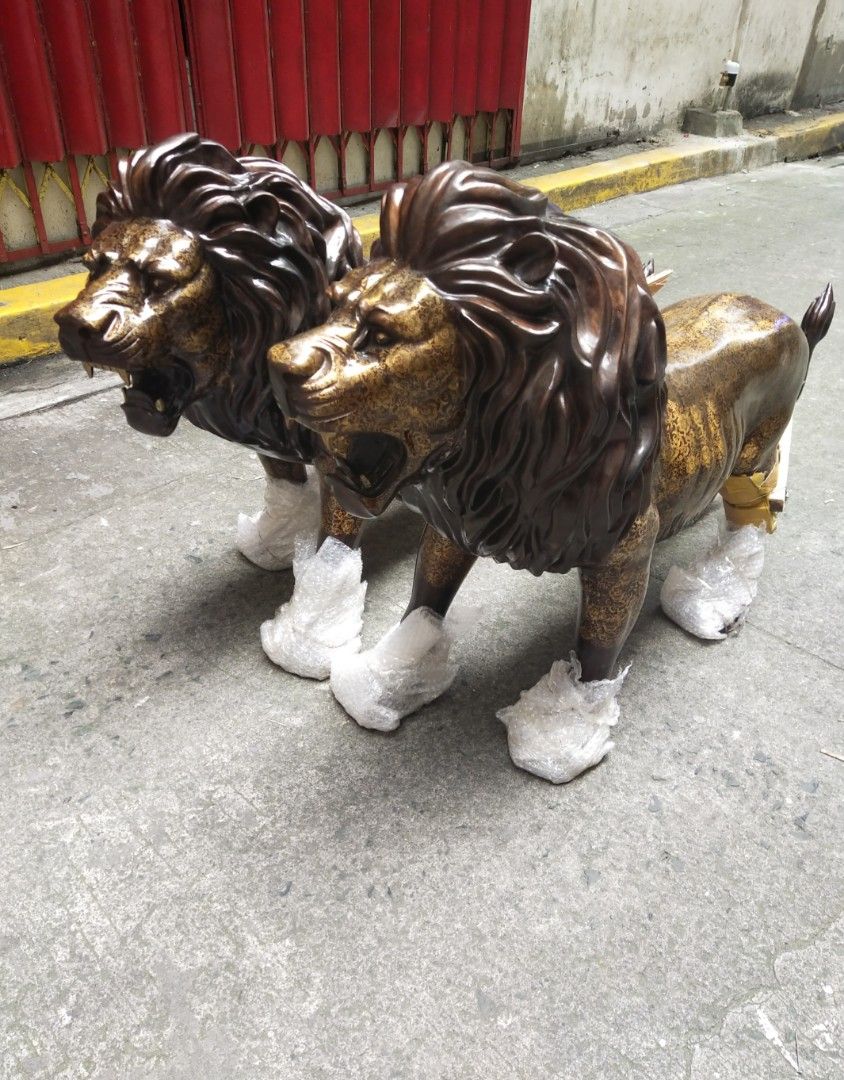 Brass life size lion statue pair display (Category: Figurines & Statues) located in Manila. Submitted by kurukutuk (Listing ID 1267933758, Image 1). Description: brass life size lion statue pair display 34 x 56 inches HxL made of brass.
