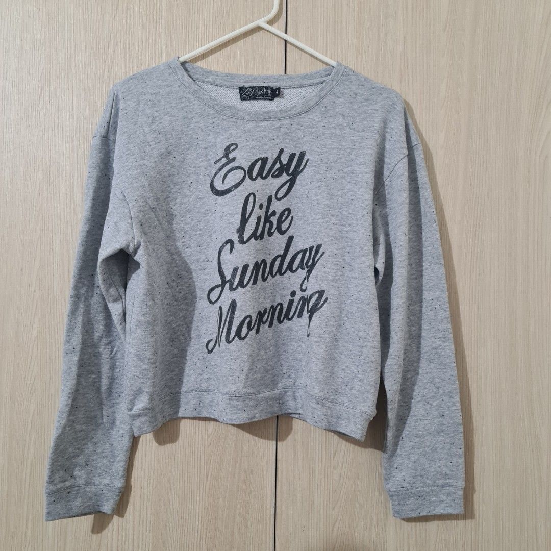Just G Gray Semi-Cropped Pullover (Category: Longsleeves) located in Cainta. Submitted by declutter_mkondostyle (Listing ID 1267865161, Image 2). Description: Color: Gray with Black Glitter Print Print: Easy Like Sunday Morning Size: 4 on tag (Fits Small) No issues ♡ Kindly consider that this is pre-loved, so please manage your expectations. Color may vary slightly due to lighting or camera setting. Do not mind the swirly thing you see in some ph