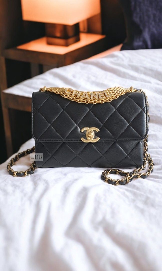 Chanel bag with gold plate on top sale