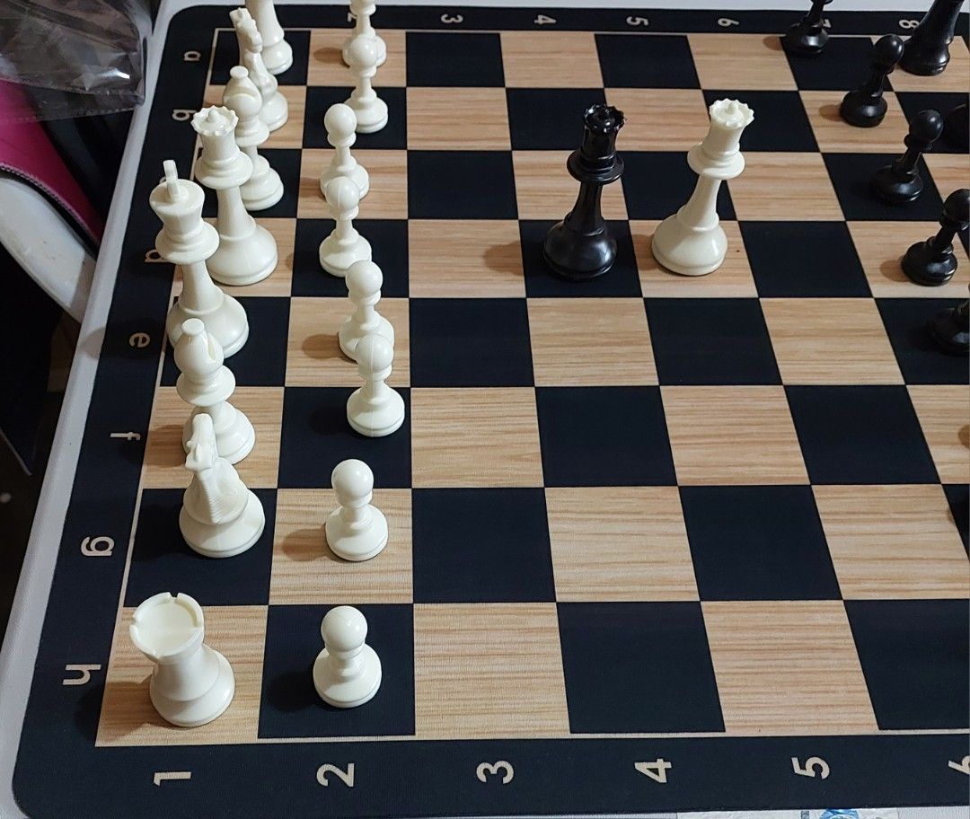 Chess Set (tournament size) (Category: Board Games & Puzzles) located in Rodriguez. Submitted by fastdog.938590 (Listing ID 1267994943, Image 3). Description: new chess mat is 51 by 51.5 cm; material is similar to mouse pad chess pieces complete with extra black and white queen.
