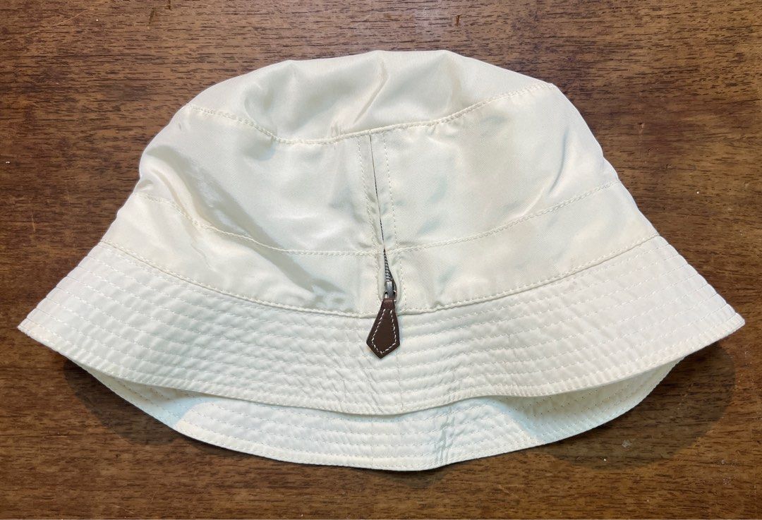 Hermes bucket hat (Category: Luxury Accessories) located in Quezon City. Submitted by raccoonfur (Listing ID 1268077391, Image 1). Description: White nylon bucket hat by Hermes. Signature leather zip. Faded content tag. Great condition nonetheless. .