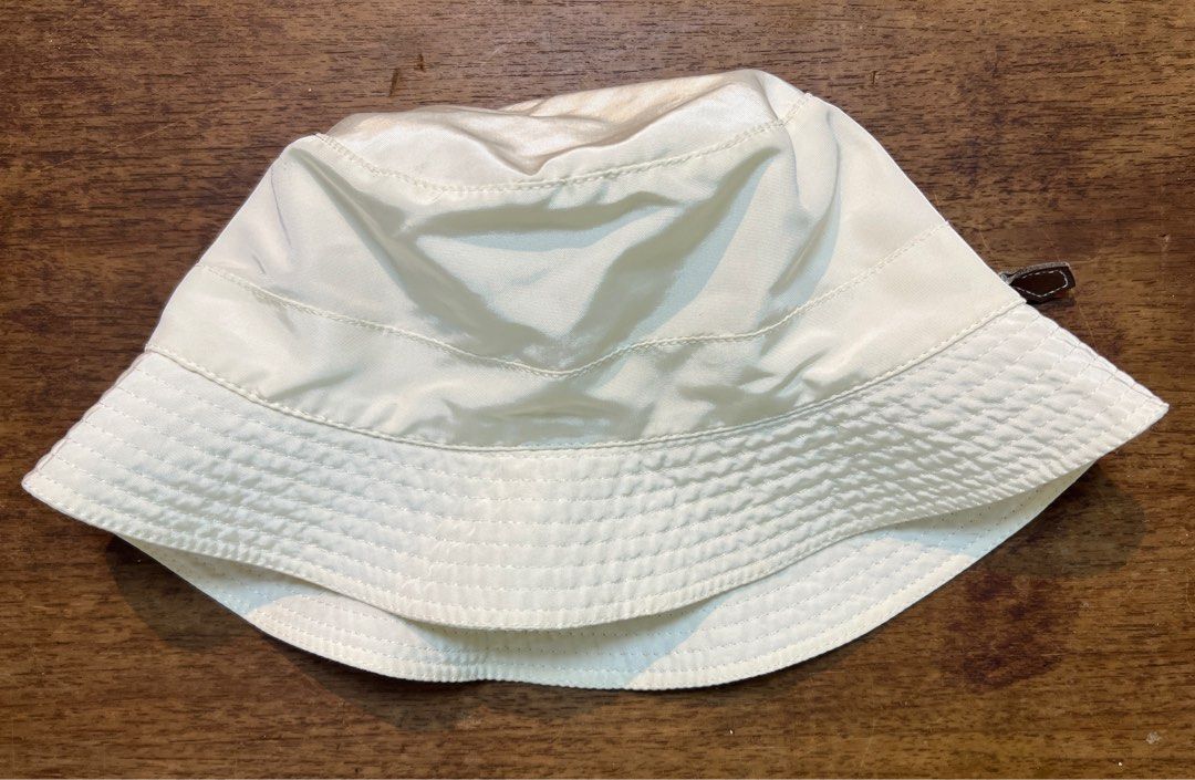 Hermes bucket hat (Category: Luxury Accessories) located in Quezon City. Submitted by raccoonfur (Listing ID 1268077391, Image 2). Description: White nylon bucket hat by Hermes. Signature leather zip. Faded content tag. Great condition nonetheless. .