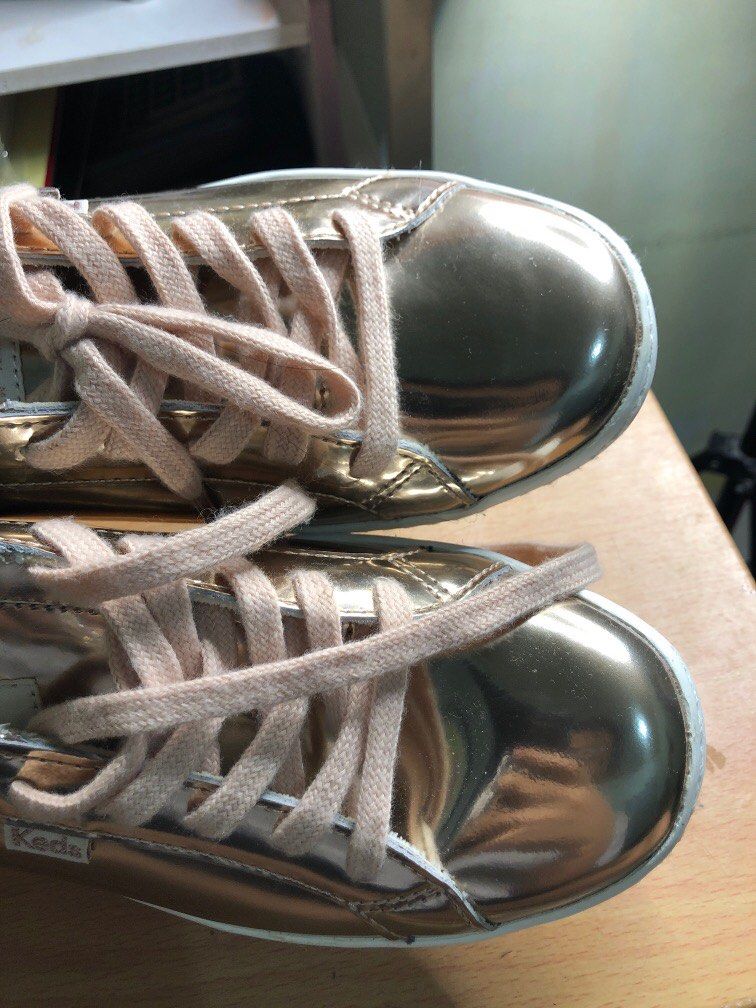 Kate Spade x Keds Shoes (Category: Sneakers) located in Minalin. Submitted by declutter_ry (Listing ID 1268042193, Image 3). Description: Kate Spade x Keds collab shoes Metallic Rosegold Padala from US! Authentic! Used twice lang, still in a very good condition. No box Size: USA 8/ UK 5.5/ EUR 39/ 25 CM Pampanga location Payment first policy! Gcash, maya, or bank transfer Mod: J&T only. SF c/o Buyer PM for more information. Reminder: Kindly refra