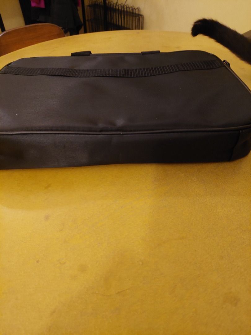 Lenovo Laptop Bag (Category: Laptop Bags & Sleeves) located in Pasig City. Submitted by mary.mary7 (Listing ID 1267997214, Image 3). Description: Size: 15 x 11 x 2 inches Color: Black Shipment/Pick Up Expense c/o Buyer.