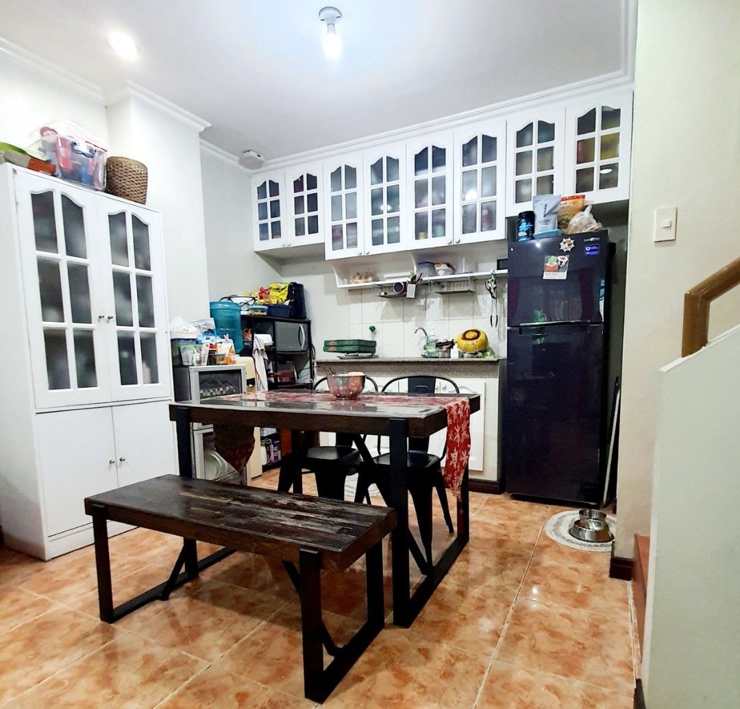Modern wooden dining table and chairs (Category: Tables & Sets) located in Quezon City. Submitted by jenserr (Listing ID 1267949734, Image 1). Description: Modern elegant design. Dining table 4 seater Wooden rustic design top with steel footing Seats 2 metal chairs and 1bench type wooden seat with steel footing with free 2 table runners and thick place cover for protection. Moving out sale Address is near Lightforce Congressional.