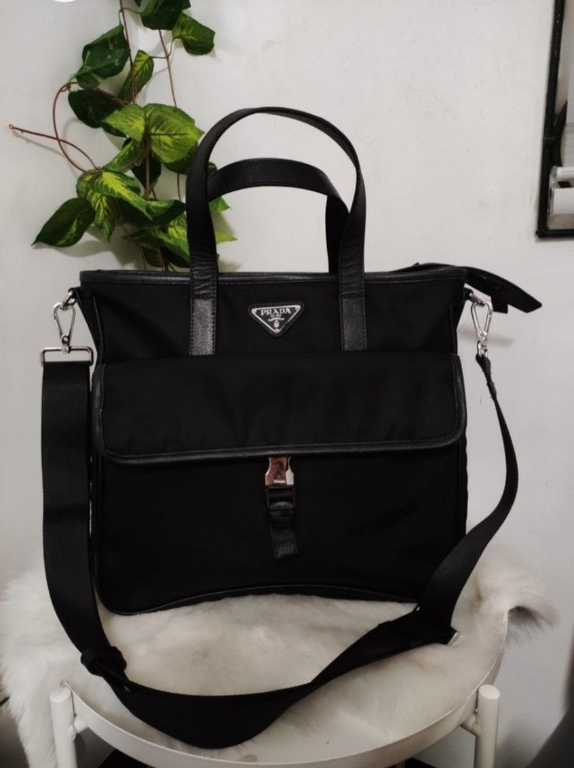Prada Nylon Document Bag (Category: Luxury Bags & Wallets) located in Santa Rosa. Submitted by sassycollection. (Listing ID 1268052616, Image 1). Description: Preloved In excellent condition Nylon material Lock Buckle in silver Handbag and Crossbody with sling.