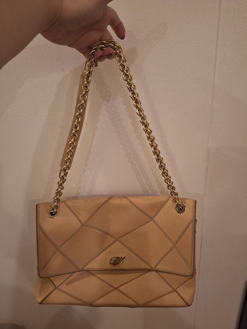 Roger vivier (Category: Luxury Bags & Wallets) located in Pasay City. Submitted by ms0718 (Listing ID 1268059718, Image 1). Description: with signs of usage and marks but inside is good and with card and dusbag. ipapa ayos mo na lang. hardware is in good condition and lock is working. no zipper problem rfs: decluterring.
