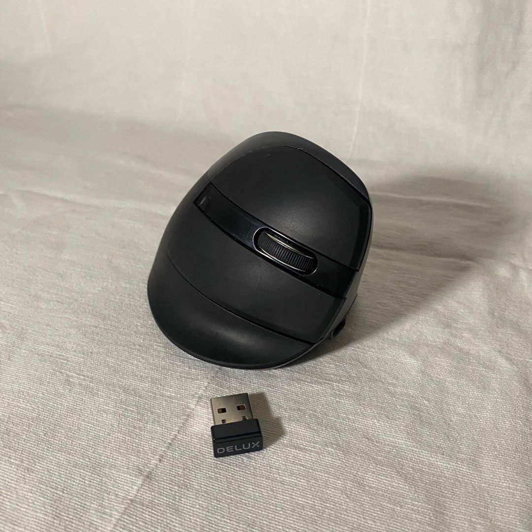 Delux M618 Mini Silent Ergonomic Mouse (Category: Mouse & Mousepads) located in Manila. Submitted by trishabb (Listing ID 1268254067, Image 1). Description: • Bought from LazMall • Rechargeable • Can be connected via bluetooth or dongle receiver.