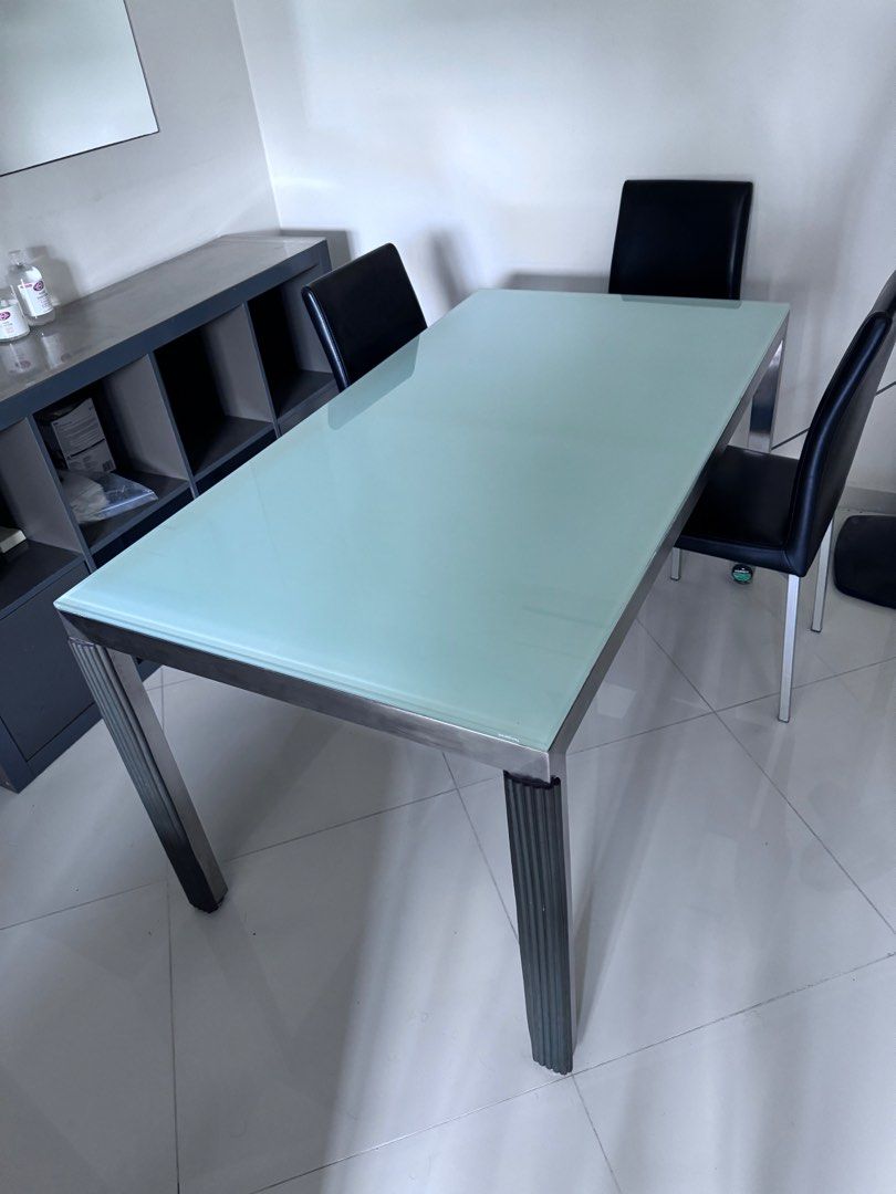 Dining Table (Category: Tables & Sets) located in Singapore. Submitted by fnh13 (Listing ID 1268181116, Image 1). Description: Dining table with tempered glass top. Free 3 black chairs in the picture. Buyer arrange for own transportation. .