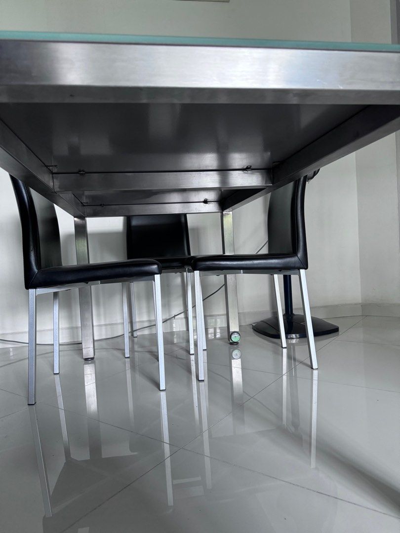 Dining Table (Category: Tables & Sets) located in Singapore. Submitted by fnh13 (Listing ID 1268181116, Image 2). Description: Dining table with tempered glass top. Free 3 black chairs in the picture. Buyer arrange for own transportation. .