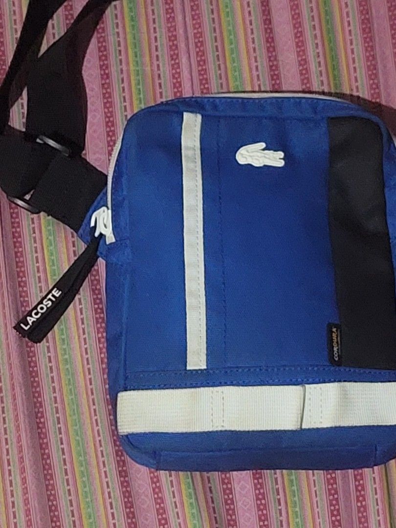 Lacoste sling bag cordura (Category: Sling Bags) located in Malabon City. Submitted by andreigabriel (Listing ID 1268146765, Image 3). Description: For sale lacoste sling bag cordura slightly used 3200 only.