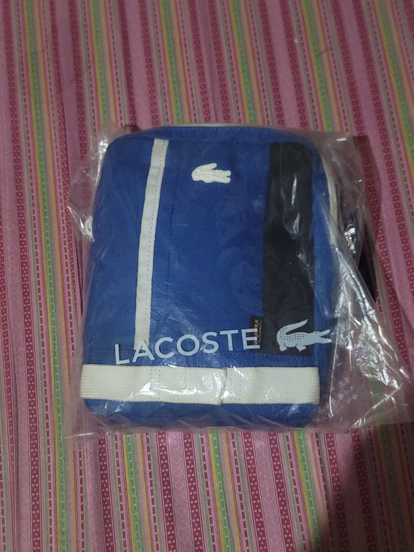 Lacoste sling bag cordura (Category: Sling Bags) located in Malabon City. Submitted by andreigabriel (Listing ID 1268146765, Image 2). Description: For sale lacoste sling bag cordura slightly used 3200 only.