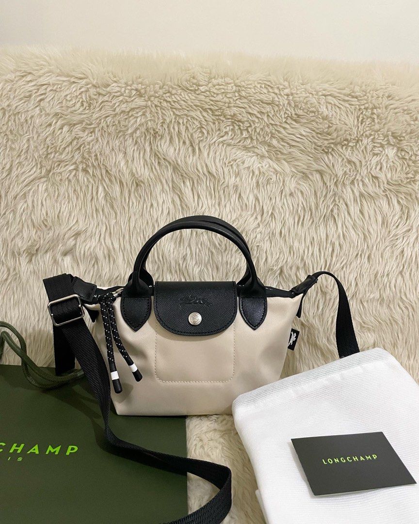 Longchamp energy xs mini authentic in ivory white (Category: Luxury Bags & Wallets) located in Cabuyao City. Submitted by luxbymishy (Listing ID 1268217097, Image 2). Description: Brand new complete inclusions Authentic .