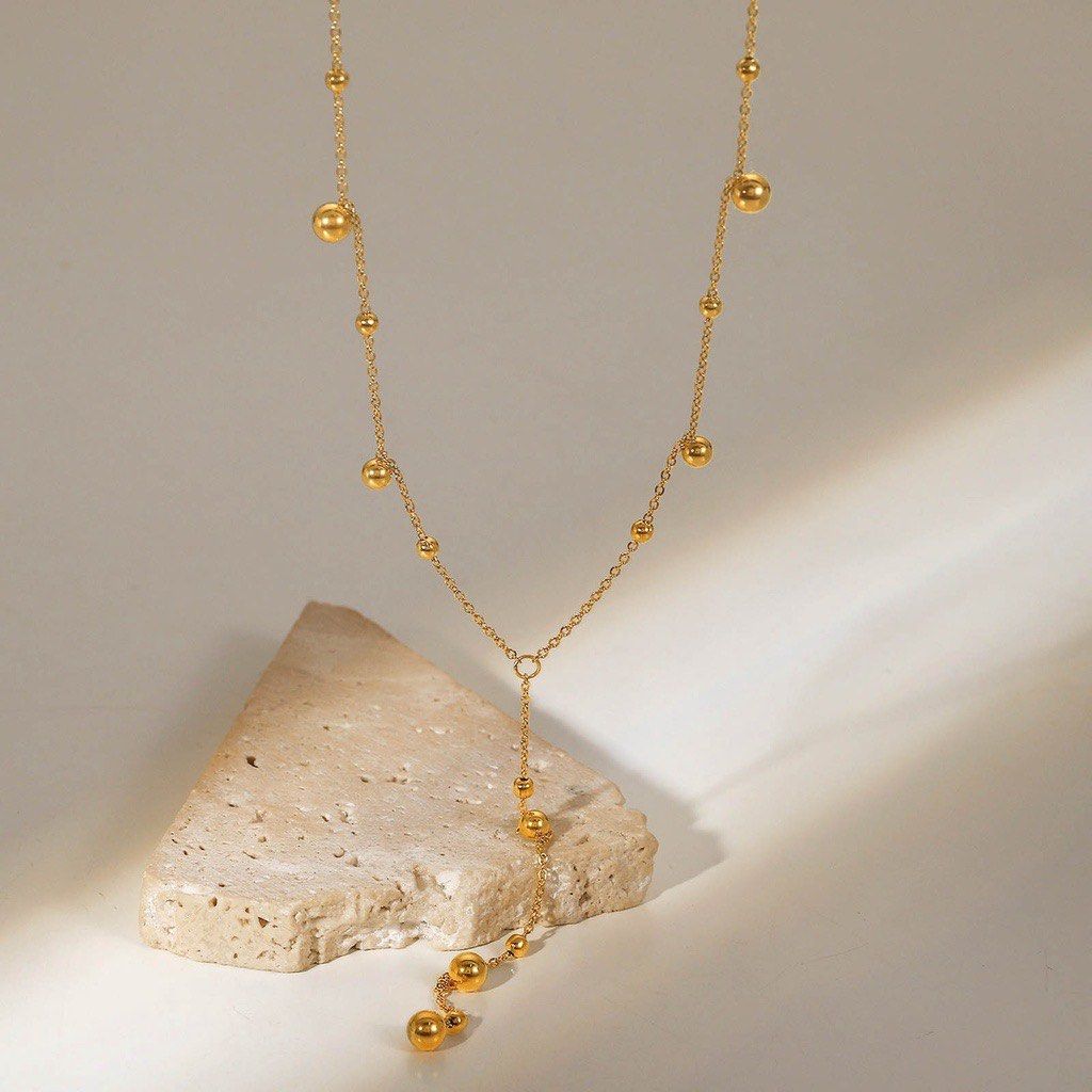 Gold tassel clearance necklace