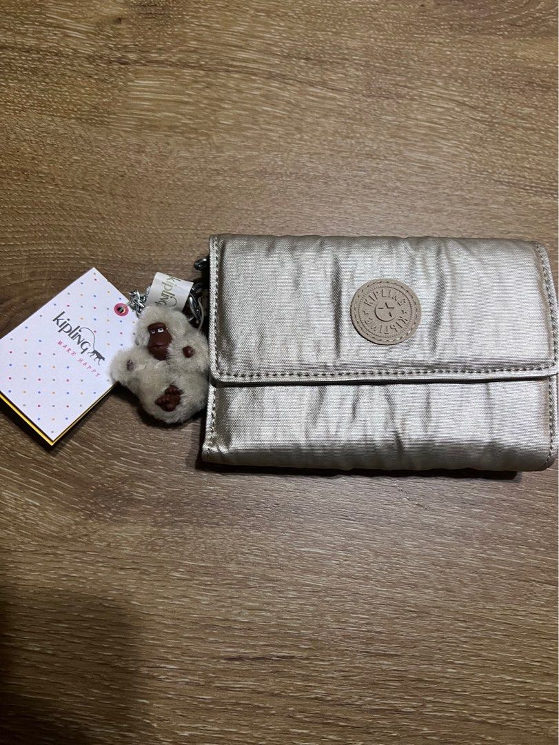Gleaming gold metallic Kipling wallet Women s Fashion Bags