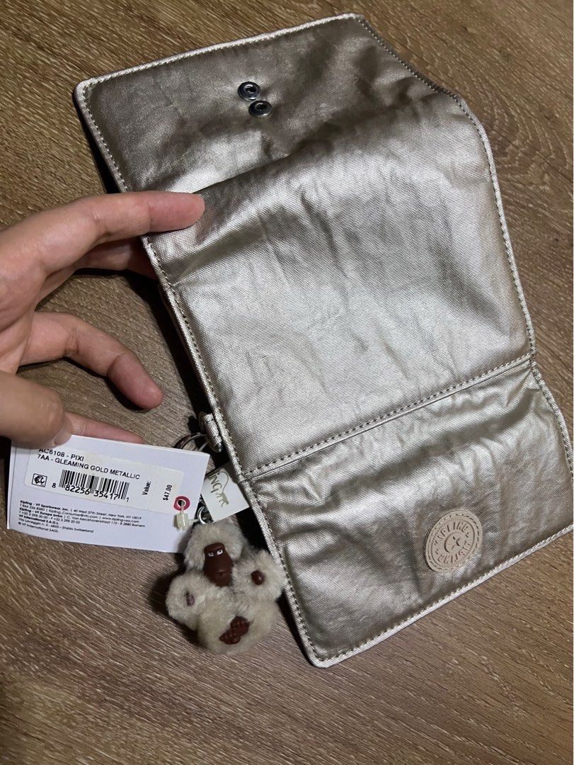 Gleaming gold metallic kipling hot sale