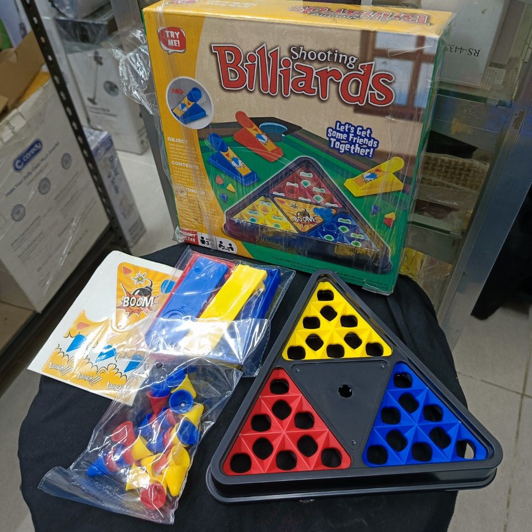 Good Sun Shooting Billiards (Category: Action & Battle Toys) located in Rizal. Submitted by TheSweetSpotShoppe (Listing ID 1268432222, Image 1). Description: • Contents: 1 × playing board with 3 colour target areas each with 9 holes. 3 × launchers. 27 × hats (9 hats each of 3 Colours).