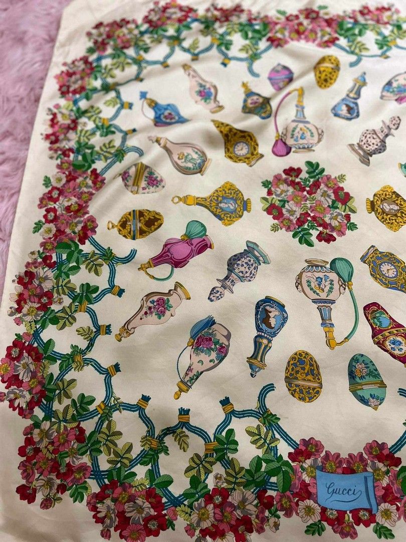 Gucci large scarf Silk square scarf (Category: Luxury Accessories) located in Teresa. Submitted by recherchediva (Listing ID 1268370169, Image 3). Description: 50% off for a limited time only!!! GUCCI Scarf 84cm 33″ floral and perfume bottles design AUTHENTIC 💯 100% pure silk rolled hem 💡This would be nice worn but is a great work of art you can hang on a frame. We can customize a wooden frame or other materials for plastic or metal with an ext