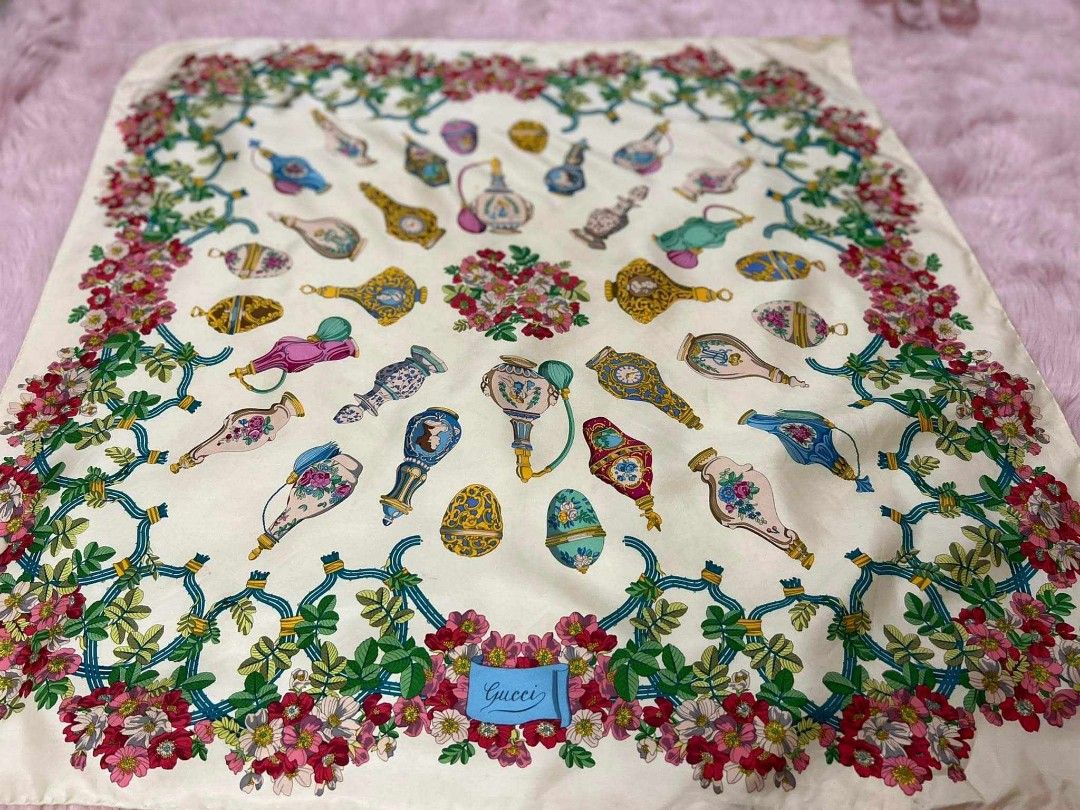 Gucci large scarf Silk square scarf (Category: Luxury Accessories) located in Teresa. Submitted by recherchediva (Listing ID 1268370169, Image 1). Description: 50% off for a limited time only!!! GUCCI Scarf 84cm 33″ floral and perfume bottles design AUTHENTIC 💯 100% pure silk rolled hem 💡This would be nice worn but is a great work of art you can hang on a frame. We can customize a wooden frame or other materials for plastic or metal with an ext