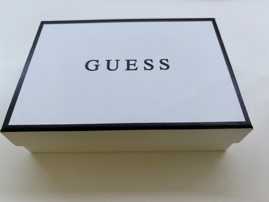 Guess Holley SLG Wallet (Category: Wallets & Card Holders) located in Singapore. Submitted by whoeven (Listing ID 1268402408, Image 1). Description: mini wallet. Colour: Cocoa has a zip..