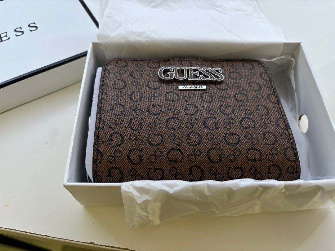 Guess Holley SLG Wallet (Category: Wallets & Card Holders) located in Singapore. Submitted by whoeven (Listing ID 1268402408, Image 2). Description: mini wallet. Colour: Cocoa has a zip..