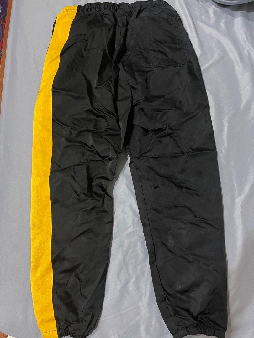 Nike nsw yellow pants hotsell