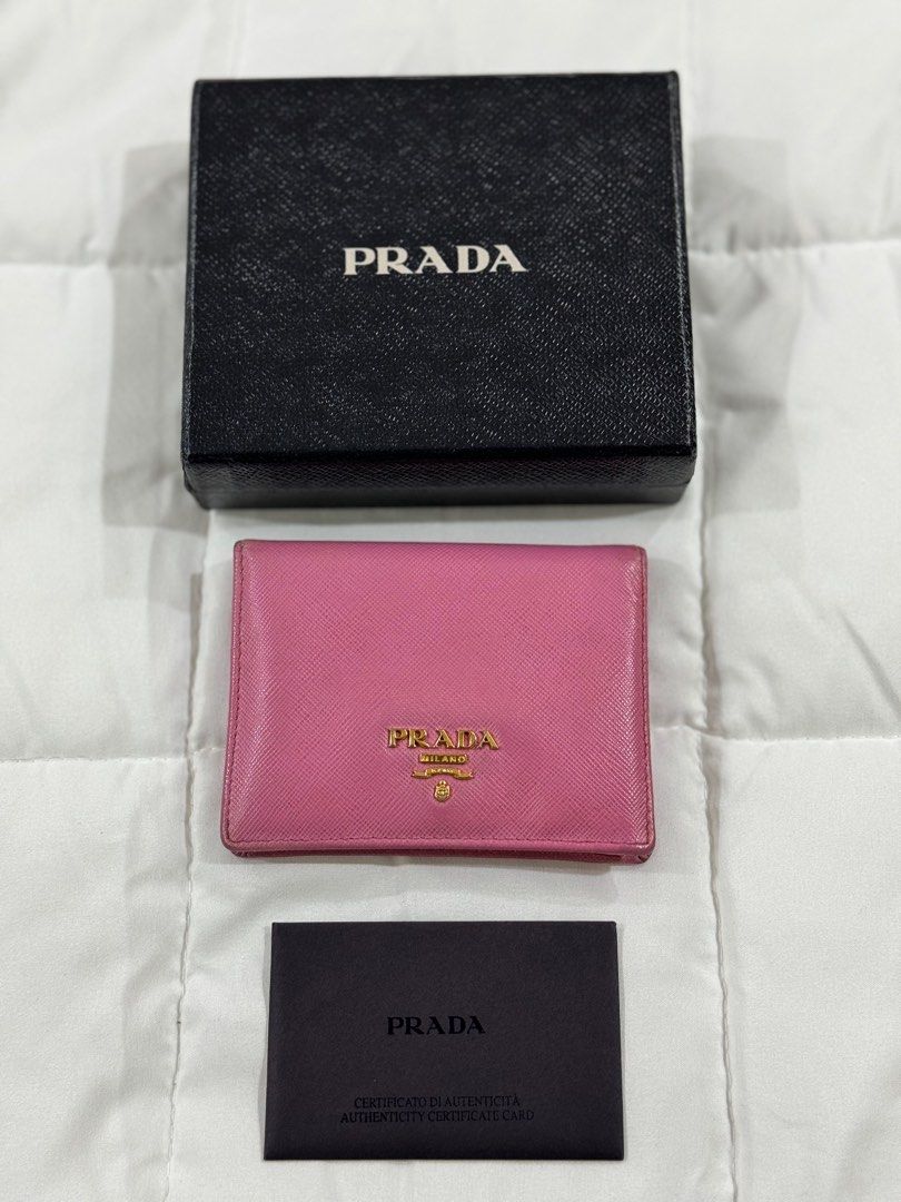 Prada Wallet (Category: Luxury Bags & Wallets) located in Quezon City. Submitted by irispx (Listing ID 1268500175, Image 2). Description: Authentic Prada Wallet With Box & Card Well Used.