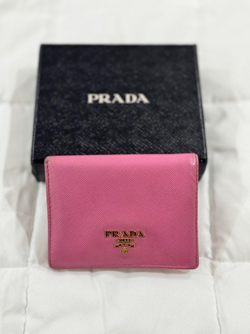 Prada Wallet (Category: Luxury Bags & Wallets) located in Quezon City. Submitted by irispx (Listing ID 1268500175, Image 1). Description: Authentic Prada Wallet With Box & Card Well Used.