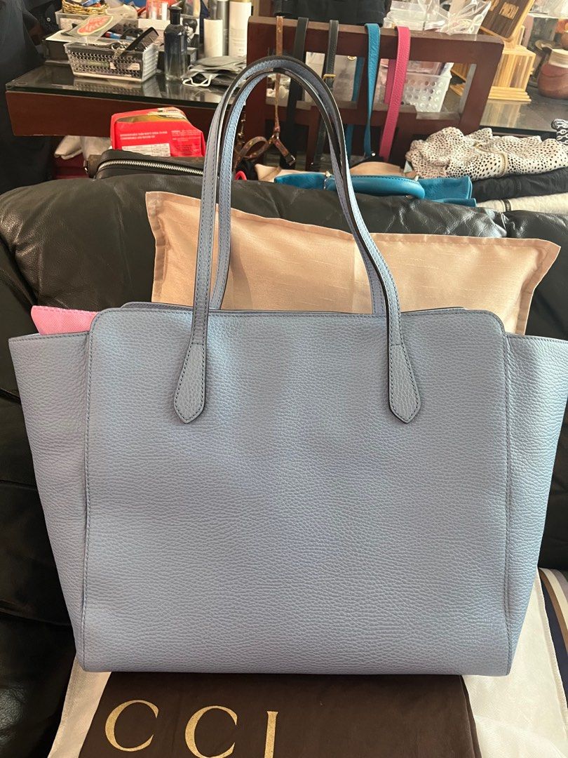 Authentic Gucci Swing (Category: Luxury Bags & Wallets) located in Makati City. Submitted by mintbags (Listing ID 1263592717, Image 3). Description: Authentic Gucci Swing Tote bag Powder blue Large Like new Used few times for travel Mint condition Check photos With dustbag and card.