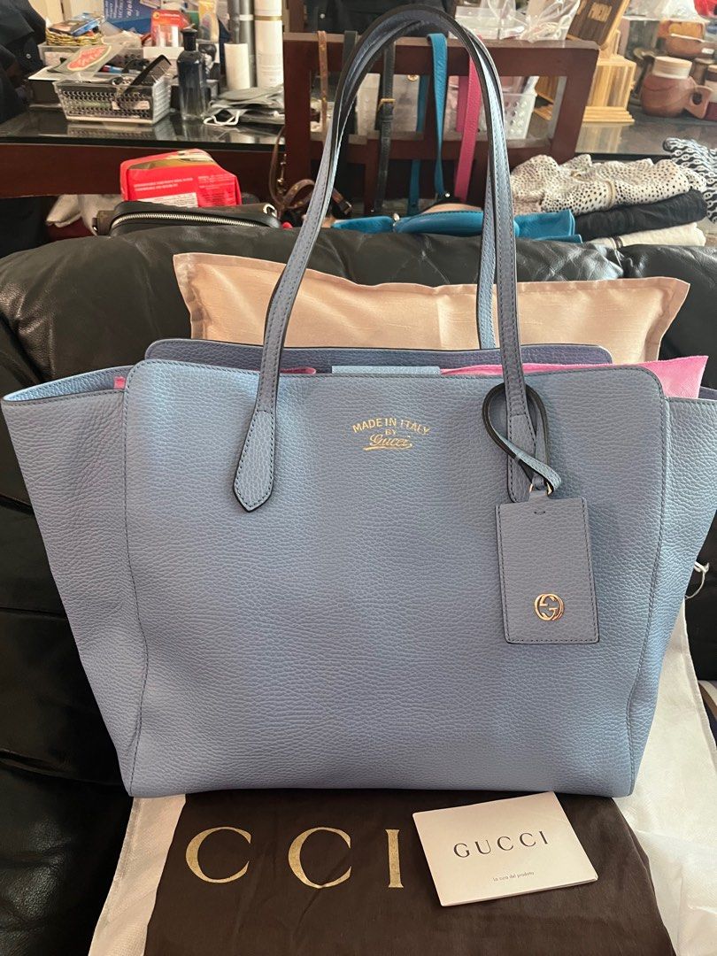Authentic Gucci Swing (Category: Luxury Bags & Wallets) located in Makati City. Submitted by mintbags (Listing ID 1263592717, Image 1). Description: Authentic Gucci Swing Tote bag Powder blue Large Like new Used few times for travel Mint condition Check photos With dustbag and card.