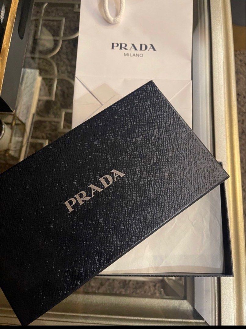 Authentic Prada Nero Wallet (Category: Luxury Bags & Wallets) located in Makati City. Submitted by kl080808 (Listing ID 1263629776, Image 1). Description: Selling my Authentic Prada Nylon Tessuto wallet, bi fold long wallet in Nero black. I personally purchased this at an outlet in Europe so guaranteed authentic!!! Used gently. As is where is. RFS - disposing my excess luxury items.