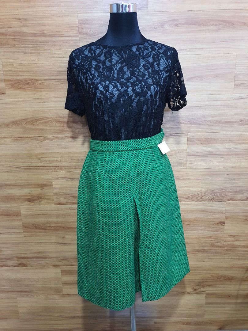 Black lace blouse and green with black box skirt