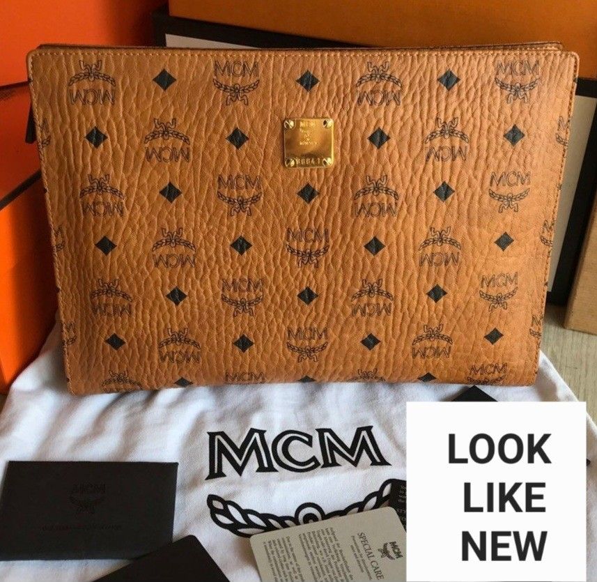 MCM Clutch Bag, Luxury, Bags & Wallets on Carousell