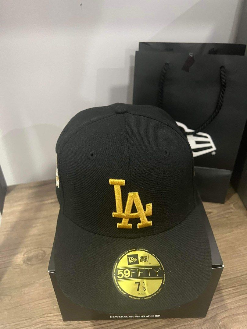 New Era 1988 World series with patch (Category: Caps & Hats) located in Paranaque City. Submitted by juan.enrique.evangelista_11 (Listing ID 1263620249, Image 2). Description: - New era cap 1988 World Series with patch - Color: Black and Gold - Complete with bag - Size: 7 1/8 - Condition 9.5/10 good as new. - Firm - mop: gcash or bank transfer - shipping shouldered by buyer.