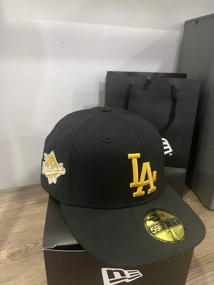 New Era 1988 World series with patch (Category: Caps & Hats) located in Paranaque City. Submitted by juan.enrique.evangelista_11 (Listing ID 1263620249, Image 1). Description: - New era cap 1988 World Series with patch - Color: Black and Gold - Complete with bag - Size: 7 1/8 - Condition 9.5/10 good as new. - Firm - mop: gcash or bank transfer - shipping shouldered by buyer.