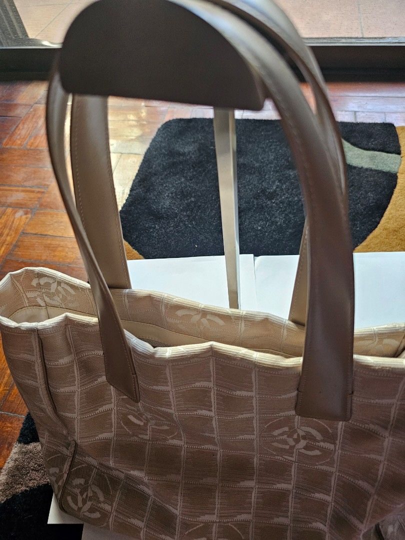 Chanel Travel line small tote (Category: Luxury Bags & Wallets) located in Makati City. Submitted by mabelle123 (Listing ID 1268579188, Image 2). Description: In great condition, with Authenticity card. Strap is like new...For daily casual use..