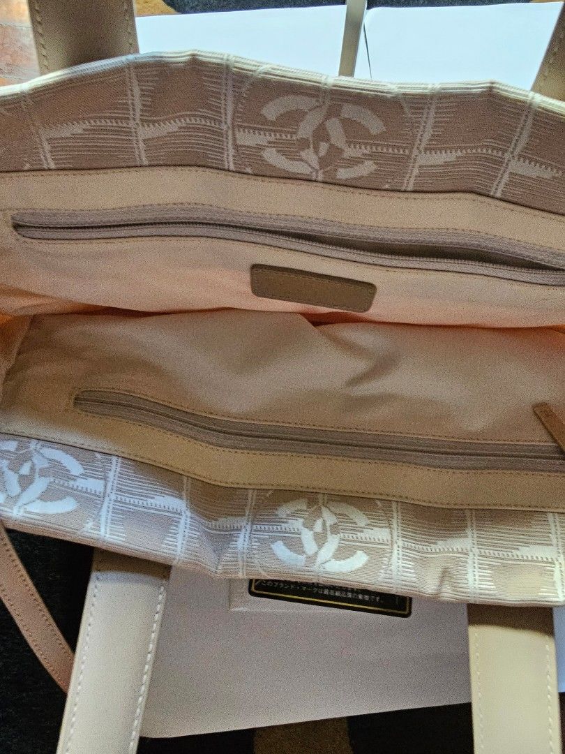Chanel Travel line small tote (Category: Luxury Bags & Wallets) located in Makati City. Submitted by mabelle123 (Listing ID 1268579188, Image 3). Description: In great condition, with Authenticity card. Strap is like new...For daily casual use..
