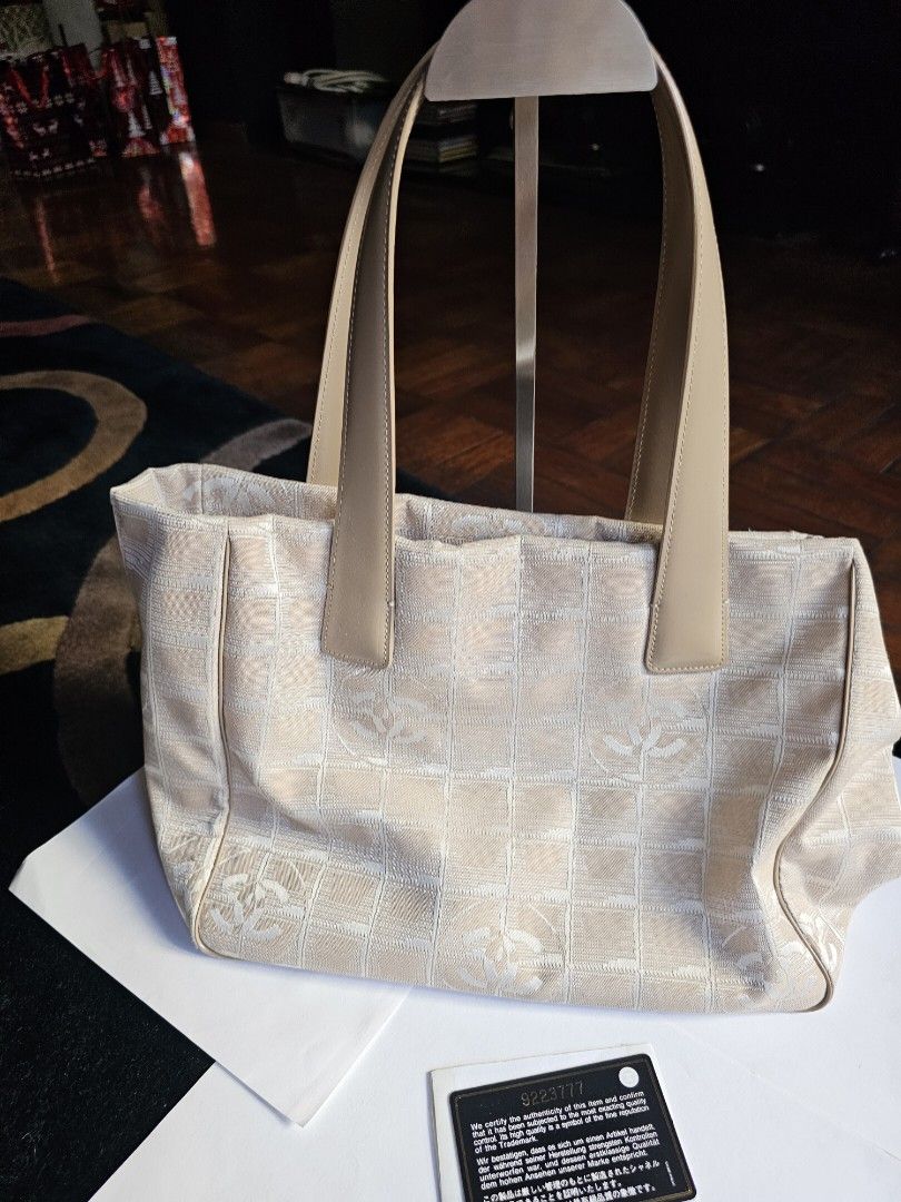 Chanel Travel line small tote (Category: Luxury Bags & Wallets) located in Makati City. Submitted by mabelle123 (Listing ID 1268579188, Image 1). Description: In great condition, with Authenticity card. Strap is like new...For daily casual use..