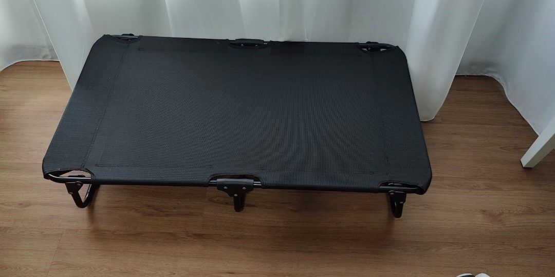 Foldable elevated bed (Category: Homes & Other Pet Accessories) located in Singapore. Submitted by chevyang (Listing ID 1268569597, Image 1). Description: selling foldable bed as dog prefers to sleep on cushions so rarely used. bed is able to fold up for easy transport as per picture 2 107cm x 62cm x 20cm.