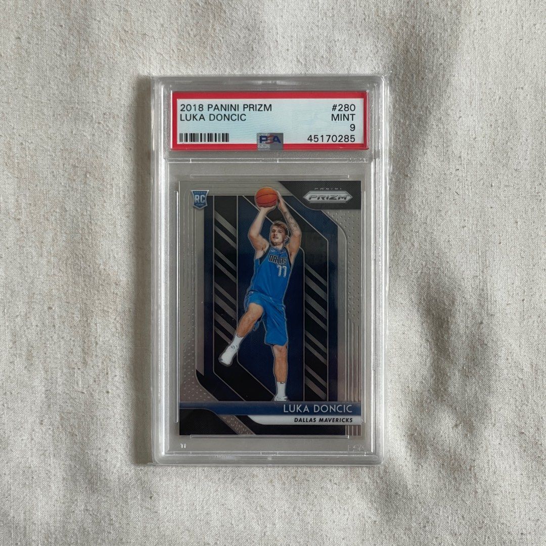 NBA Card “Luka Doncic” (Category: Raw Singles) located in Quezon City. Submitted by mrclg (Listing ID 1268685261, Image 1). Description: PLEASE CHECK PRICES BELOW: LUMINANCE RC BECKETT 9 - 5,000 PRIZM RC PSA 9 - 6500 (SOLD) PRIZM BASE - 1000 PRIZM BASE - 1000 DONRUSS RC - 4500 DONRUSS Clearly - 500 NBA HOOPS RC - 2500 PLAYOFFS RC - 2000 SENSATIONAL GU - 3000 SUIT SHOT - 500 DOMINANCE - 500 CHRONICLES - 500 LUMINANCE BASE - 500 Location: QC.