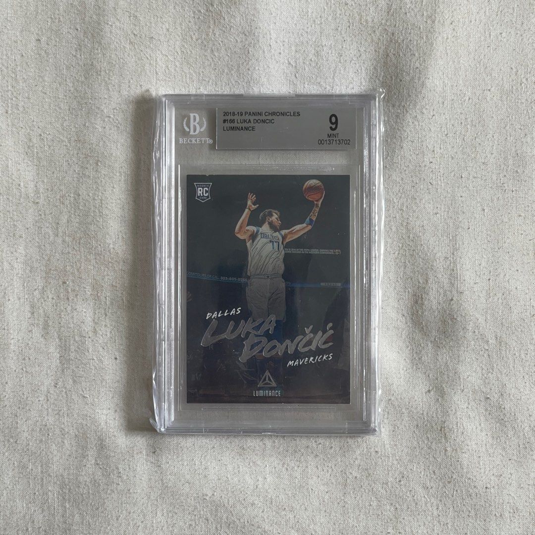 NBA Card “Luka Doncic” (Category: Raw Singles) located in Quezon City. Submitted by mrclg (Listing ID 1268685261, Image 2). Description: PLEASE CHECK PRICES BELOW: LUMINANCE RC BECKETT 9 - 5,000 PRIZM RC PSA 9 - 6500 (SOLD) PRIZM BASE - 1000 PRIZM BASE - 1000 DONRUSS RC - 4500 DONRUSS Clearly - 500 NBA HOOPS RC - 2500 PLAYOFFS RC - 2000 SENSATIONAL GU - 3000 SUIT SHOT - 500 DOMINANCE - 500 CHRONICLES - 500 LUMINANCE BASE - 500 Location: QC.