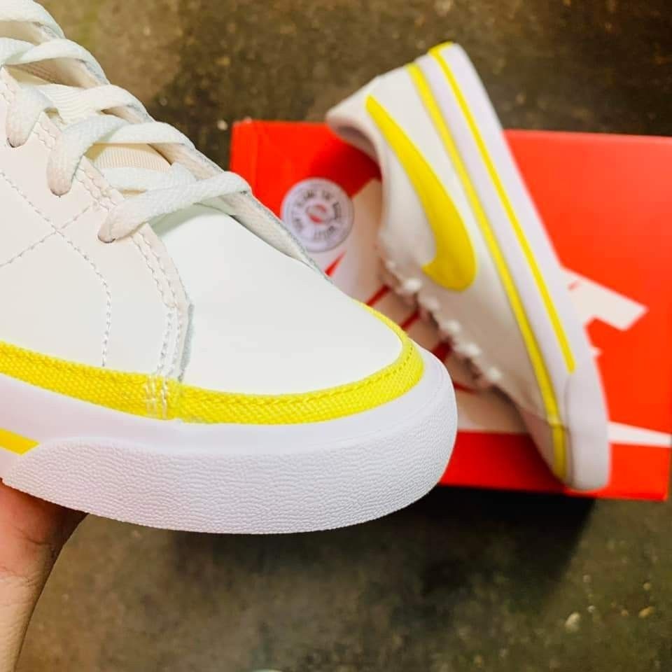 White yellow nike store
